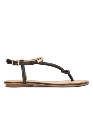 Sandali piatti in pelle nera con design a T e dettaglio a nodo, accenti dorati e suola marrone. Con cinturino regolabile alla caviglia.