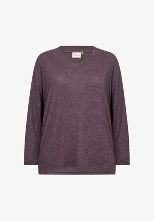 Dlhý rukáv s výstrihom do V v tlmenej purpurovej farbe. Mäkká, štruktúrovaná tkanina s voľným strihom a bočnými rozparkom v dolnej časti pre zvýšený komfort.