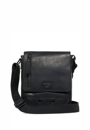 Black leather messenger bag with a flap closure, front zip pocket, adjustable strap, and embossed logo. Features a smooth texture and rectangular shape.
