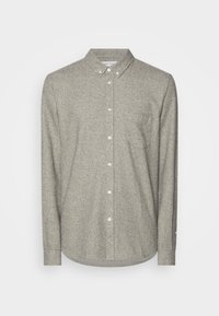 Hellgraues Hemd zum Knöpfen aus strukturiertem Stoff. Verfügt über einen spitzen Kragen, lange Ärmel und eine einzelne Brusttasche.