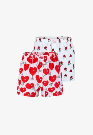 Weiße Boxershorts mit einem verspielten roten Herzmuster, elastischem Bund und lockerer Passform, aus einem leichten Baumwollmix gefertigt.