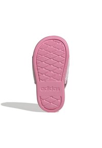 Sole di scarpa in gomma rosa con superficie testurizzata e a motivo. Presenta il marchio "adidas" in rilievo vicino al tallone. Forma piatta per un maggiore comfort.