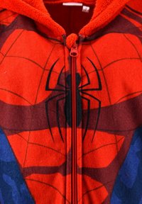 Close-up of a red and blue Spider-Man themed fleece hoodie with a black spider logo and a red zipper on the front.