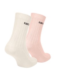 Dwie pary skarpetek prążkowanych: jedna w kolorze ecru, a druga różowa. Każda z nich ma czarne logo na mankiecie. Miękka dzianina.
