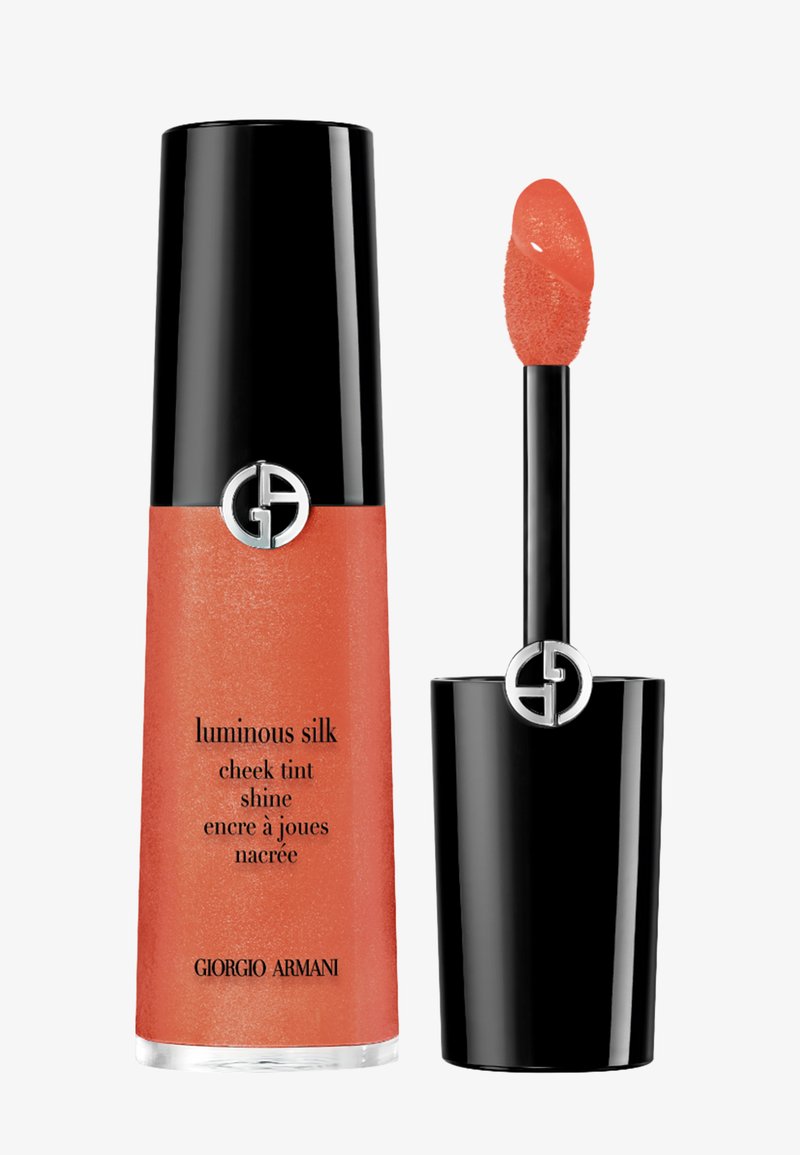 Giorgio Armani Luminous Silk kindtint med sort låg, koralfarvet flydende tint og adskilt påføringsstav.