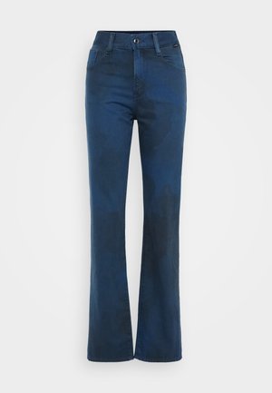 Dunkelblaue, ausgestellte Denim-Jeans mit leichtem Wasch-Effekt, mit einer vorderen Knopfschließe, Gürtelschlaufen und zwei vorderen Taschen.