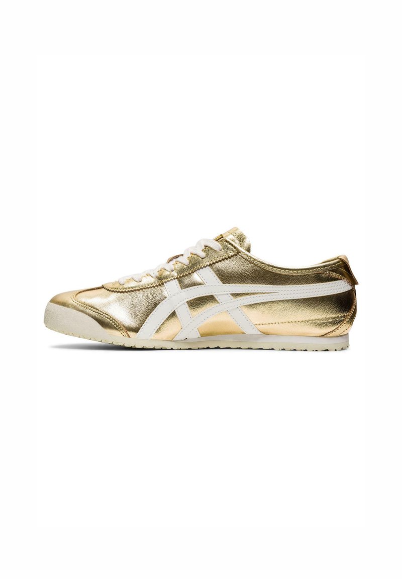 Gold metallic sneaker with white accents. Features a smooth texture, low profile, and classic lace-up design. Rubber sole for traction.