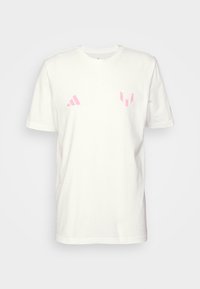 White cotton T-shirt with short sleeves, featuring pink Adidas logo and emblem on the chest. Classic crew neckline, smooth texture.