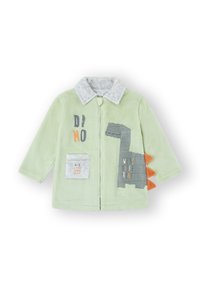 Chaqueta de vellón en verde claro con cuello gris. Presenta un diseño de dinosaurio, detalles en naranja y un bolsillo delantero con texto en varios colores.