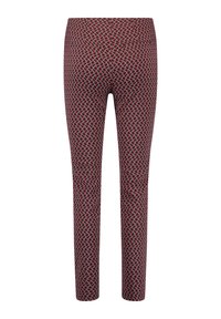 Leggings in un tessuto stampato con un design geometrico rosso e nero. Il materiale sembra elastico; silhouette aderente con una vita elastica.