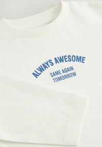 Niet geselecteerd, white slogan