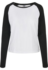 Bílé tričko s dlouhým rukávem typu raglan, černými rukávy. Vyrobeno z měkké bavlny, s kulatým výstřihem a kontrastním designem.