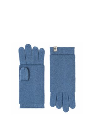 Blaue gestrickte wandelbare Handschuhe mit einer umklappbaren Fäustlingsklappe und einem kleinen eingenähten Etikett an einem Handgelenk.