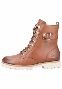 Brązowy skórzany botek za kostkę z okrągłym noskiem, złotymi elementami i sznurowanym designem. Posiada akcent w postaci klamry oraz teksturowaną, wytrzymałą podeszwę.
