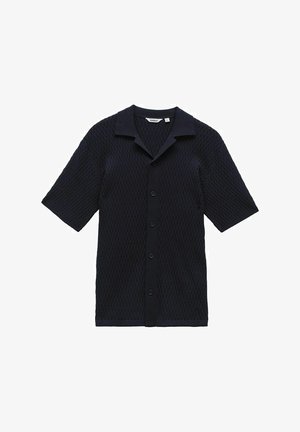 Laivaston lyhythihainen paita teksturoidusta neulekankaasta, jossa on kaulus, etuvetoketju ja rento istuvuus. Sisältää hienovaraisen kuvion.