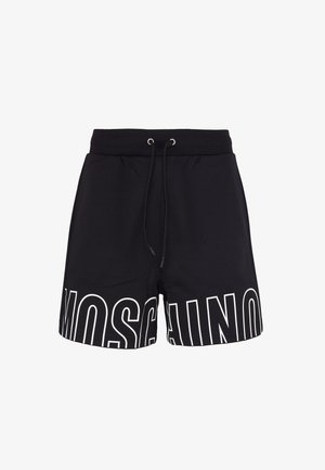 Pantaloni neri con cintura regolabile, caratterizzati da una grande scritta bianca "MOSCHINO" sul lato sinistro e un tessuto liscio e strutturato.