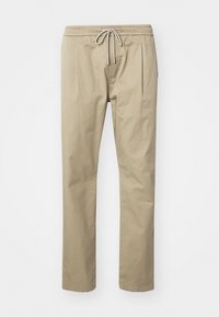 Beige cotton trousers with an elastic waistband, drawstring closure, and two front pleats. Straight-leg design and simple stitching details.