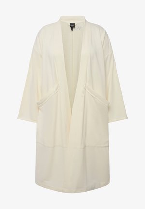 Beżowy, lekki szlafrok o luźnym kroju, z szerokimi rękawami i dwiema przednimi kieszeniami. Wykonany z miękkiego materiału o minimalistycznym wzornictwie.