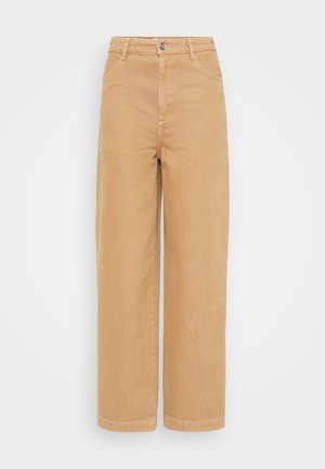 Pantaloni largi de culoare bej, din bumbac, cu o textură netedă. Prezintă o închidere frontală cu nasture și două buzunare laterale.