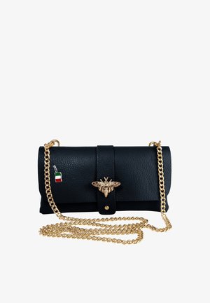 Black leather clutch with gold bee clasp, long gold chain strap, and small Italian flag charm on chain link.