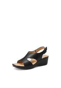 Sandalo con tacco wedge in pelle nera, con punta aperta e ritagli laterali. Presenta un cinturino con fibbia regolabile. Soletta in sughero.