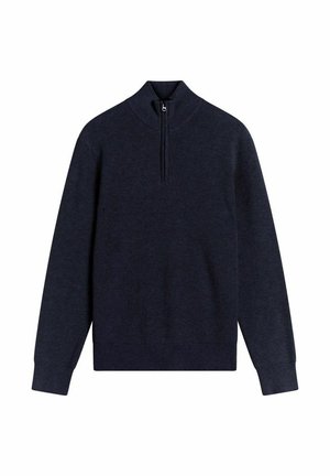 Tummansininen ribbipullover, jossa on vetoketjukaulus, pitkät hihat ja istuva helma. Pehmeä tekstuuri, rento muotoilu, joka soveltuu kerrostamiseen.