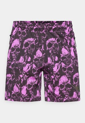 Black shorts featuring a pink skull pattern, made from a textured mesh fabric. Includes side zipper pockets and an elastic waistband.