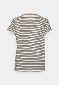 Striped t-shirt with a round neckline and short sleeves, featuring horizontal black and cream stripes, made from lightweight cotton.