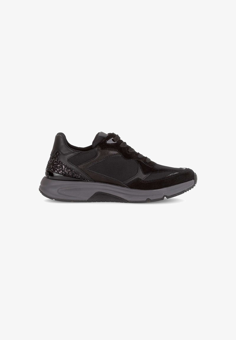 Black sneaker featuring a mix of mesh and suede materials, with a textured heel accent and a thick rubber sole for cushioning.