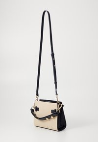 Tommy Hilfiger HERITAGE MINI SATCHEL - Handtas - space blue/canvas