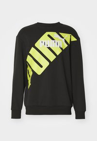 Felpa nera con un audace logo "PUMA" in neon giallo diagonale e design grafico, realizzata in morbido tessuto testurizzato con maniche lunghe.
