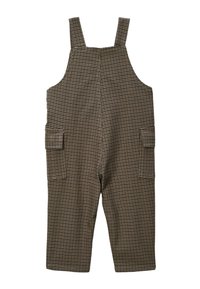 Salopette à carreaux marron et crème avec bretelles réglables, deux poches latérales et jambes larges. Fabriquée en tissu mélangé coton.