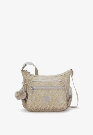 Sac bandoulière beige texturé avec une poche zippée à l'avant, un compartiment latéral zippé et un charm en fourrure attaché à la sangle.