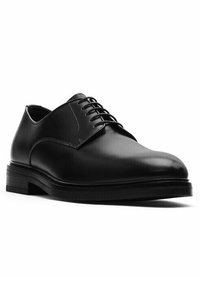 Scarpa da uomo in pelle nera con finitura liscia, punta arrotondata, design con lacci e suola robusta in gomma nera.
