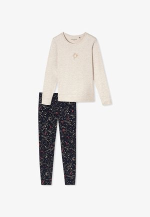 Vaaleanbeige pitkähihaine paita, jossa on auringon graafinen kuva, yhdistettynä tummansinisiin legginsseihin, joissa on värikäs avaruusteema ja taivaankappaleiden kuvasto.