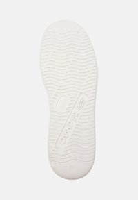 White sneaker sole with wavy tread pattern and "Camper" branding. Size marked as 36. Clean and simple design focused on functionality.