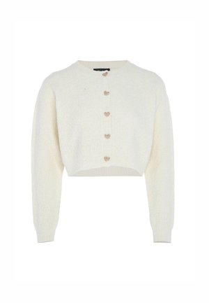 Cardigan corto color crema in tessuto texturizzato con maniche lunghe e cinque bottoni a forma di cuore sulla parte anteriore. Polsini e orlo a costine.