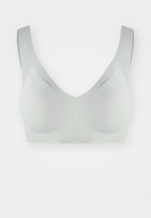 Valge sujuv rinnahoidja laiate rihmade ja V-kaelusega, paigutatud lihtsa valge tausta keskosa.