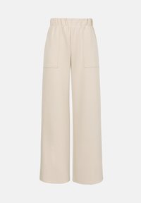 Μπεζ παντελόνι με φαρδύ πόδι, ελαστική μέση και εμπρόσθιες τσέπες με πατς, κατασκευασμένο από λείο ύφασμα.