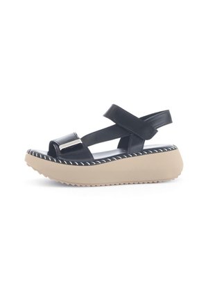 Black leather wedge sandal with crisscross straps, adjustable back, beige platform sole, and white stitching detail along the edge.