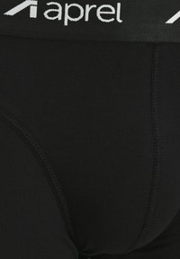 Schwarze Herrenunterwäsche mit glatter Textur, elastischem Bund mit "aprel"-Logo und verstärkten Nähdetails.