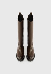 Brown leather knee-high boots with smooth texture, rounded toe, and a low platform, featuring rear pull tabs and side zippers for easy wear.