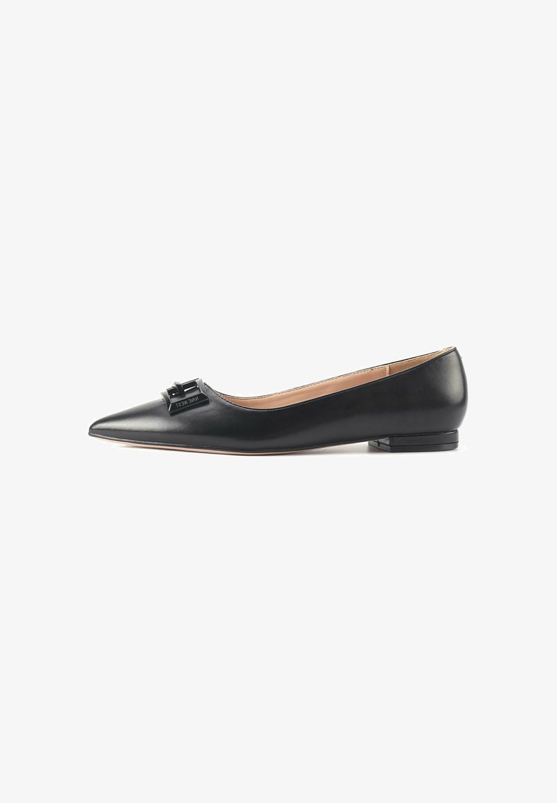 Black leather ballet flats with a pointed toe, featuring a decorative bow detail on the vamp and a low, square heel. Smooth texture.