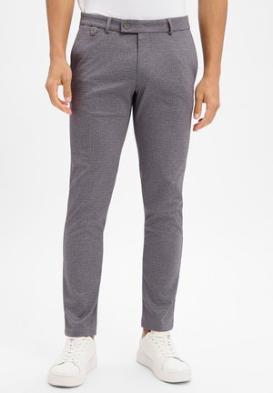 - Spodnie materiałowe