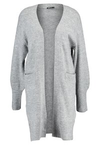 Grå öppen cardigan i mjukt stickat tyg. Har två framsidor med fickor och ribbade muddar för extra struktur. Klassisk lös passform.