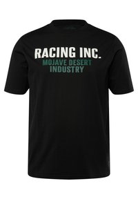 Camiseta de algodón negra con gran texto en blanco y verde: "RACING INC." y "MOJAVE DESERT INDUSTRY." Manga corta, ajuste estándar.