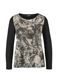 Lange mouw top met een zwart lichaam en een textuur voorkant met een grijs bloemenpatroon. Ronde halslijn, zacht materiaal en stikseldetails.