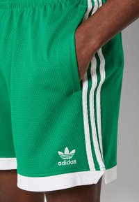 adidas Originals MOCK EYELET - Träningsbyxor - green