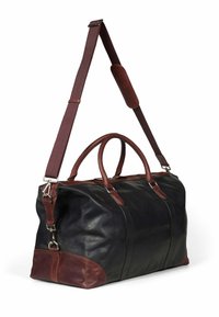Leather duffel bag in black with brown accents; features two handles, an adjustable strap, and a smooth texture.