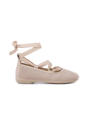 Beige suede ballet shoes with crisscross ankle straps, rounded toes, and a flat rubber sole. Smooth texture with minimal design details.